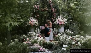 Travis Kelce kneeling down to propose to Taylor Swift